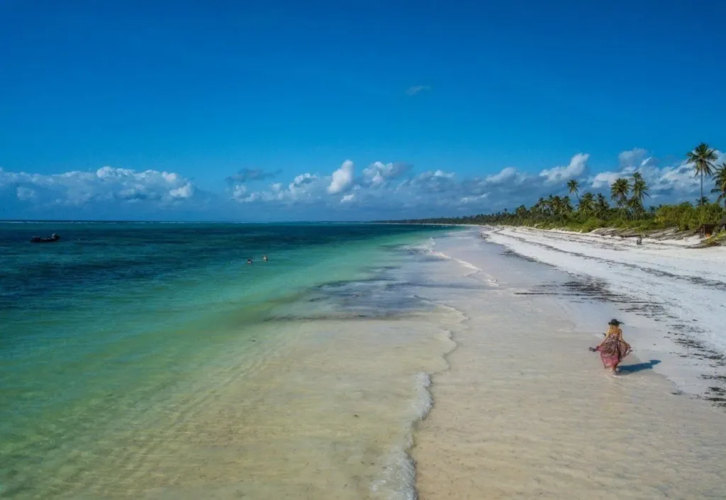 Serene private beach with turquoise waters in front of Zanzibar Queen Hotel.