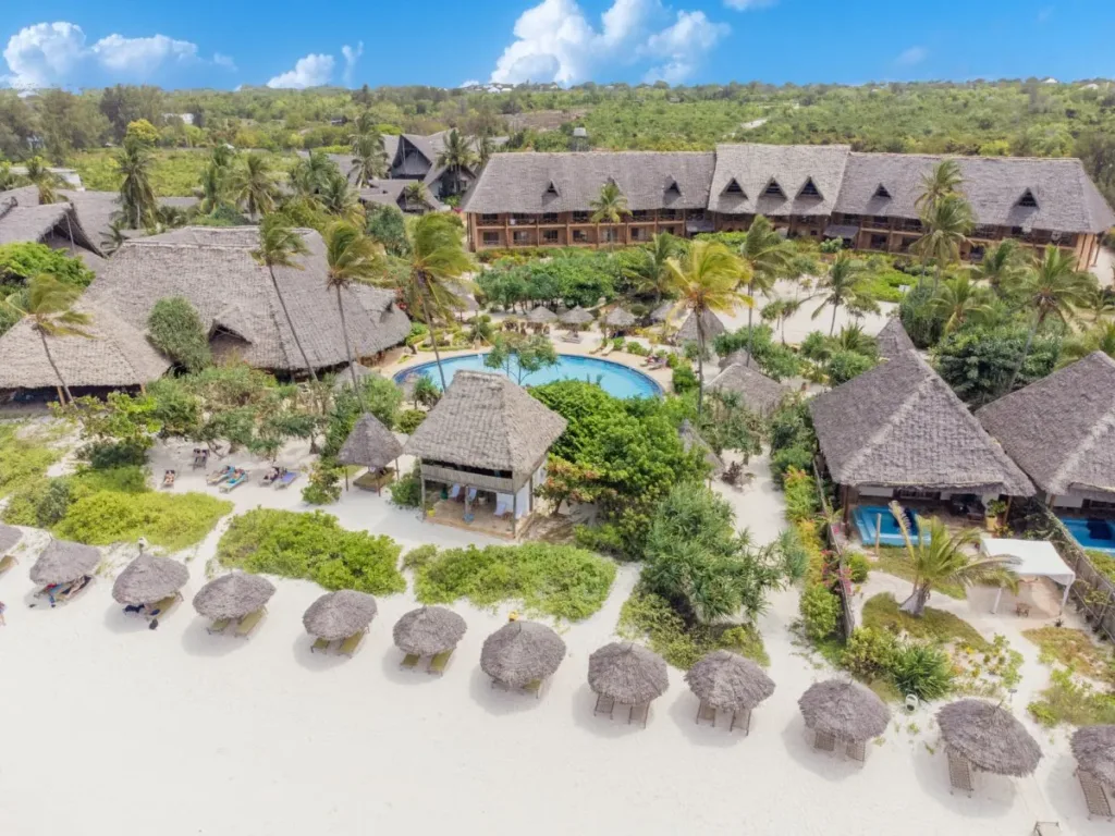 Serene private beach with turquoise waters in front of Zanzibar Queen Hotel.